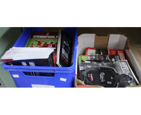 Two boxes of Liverpool football programmes
