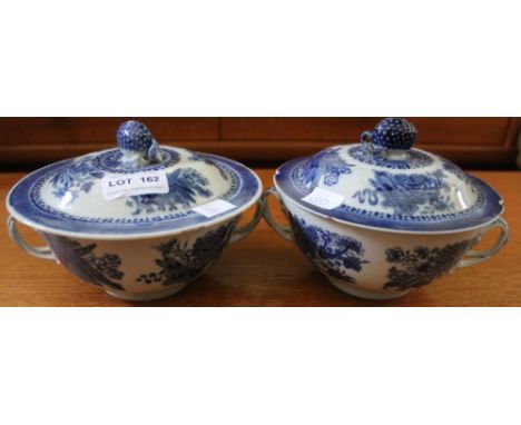 A pair of Chinese late Qianlong porcelain lidded bowls, each with two opposing entwinned handles, cobalt blue decoration, dom