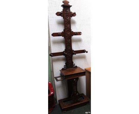 An Edwardian carved oak hallstand, having glove compartment &amp; stick/umbrella stands