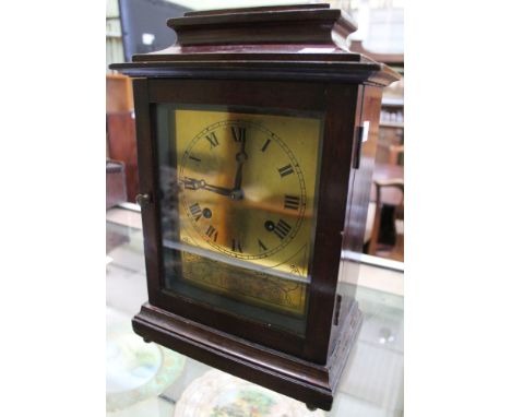 A Georgian design, mahogany cased bracket clock, brass face with Roman numerals, overall 34cm high