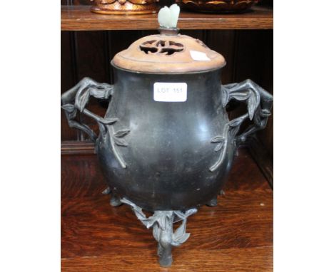 A Chinese bronze censer, baluster form with cast bamboo feet and handles, fitted a pierced wooden cover with jade knop, overa