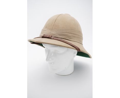 A 1942 dated British military issue Wolseley pattern tropical helmet