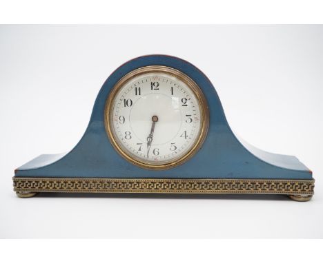 An early 20th Century lacquered and brass-mounted mantel clock of "Napoleon's hat" shouldered form, 30 cm x 15 cm high