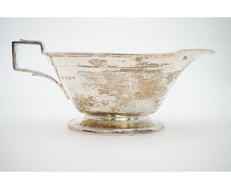 A George VI silver sauce boat of Art Deco influence, Roberts &amp; Belk, Sheffield, 1945, with trademark stamped to base, 218