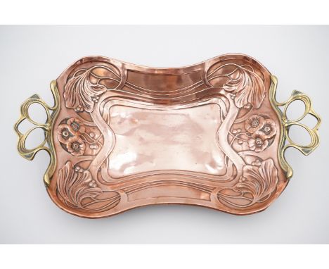 An early 20th Century copper and brass tray by Carl Deffner, embossed in a pronounced jugendtstil / art nouveau floral patter