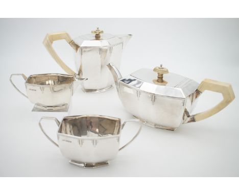 A George V silver four-piece Art Deco tea service, comprising tea pot, hot water, sugar bowl and milk jug, of elongated octag