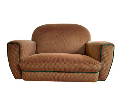 A 1930s Art Deco style three-piece suite, fully re-upholstered, an internal label discovered during re-upholstering indicatin