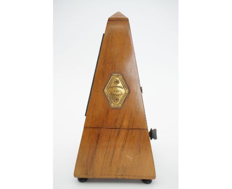 An antique Maelzel metronome, 23 cm