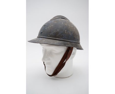 A Great War French Adrian Model 1915 trophy helmet painted with the locations of battles