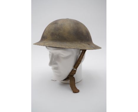 A Second World War British army Mk 1* helmet, comprising a Great War shell with retro-fitted Mk 2 liner