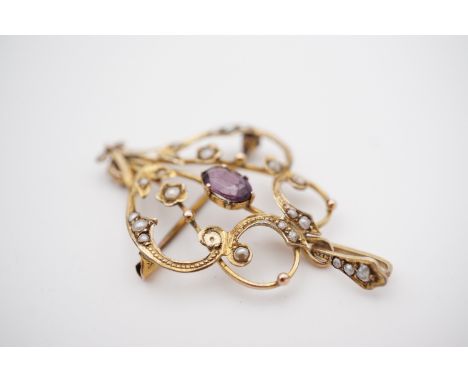 A Belle Epoque amethyst and pearl openwork pendant brooch, of Art Nouveau design, with central oval cut amethyst of approxima