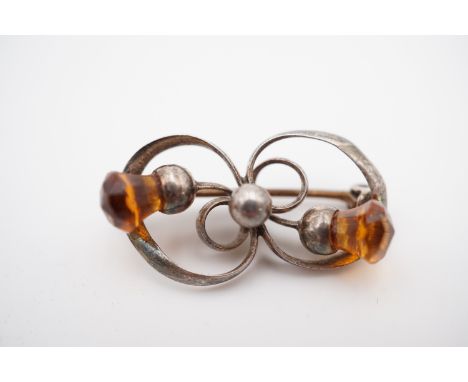 A Charles Horner silver and citrine brooch, of Art Nouveau design, in the form of two entwined thistles, Chester, 1913, 2.6g