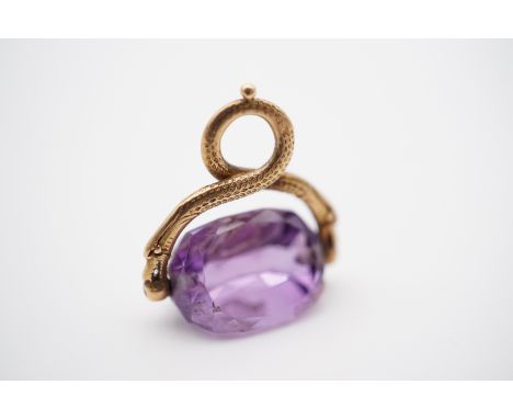 An antique Irish yellow-metal and amethyst swivel fob seal, the suspender modelled as a coiled serpent, the faceted amethyst 