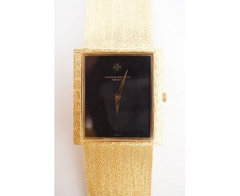 A 1980s Vacheron Constantin gentleman's 18 ct gold wrist watch, having manual wind movement and rectangular black enamel face