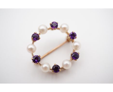 A 9ct gold, amethyst and pearl wreath brooch retailed by Hamilton and Inches, 3.8g, 2 cm