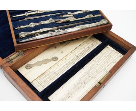 A Victorian cased set of "German silver" drawing instruments, including ivory parallel rule, protractor and sector, 19 cm x 1