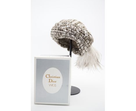 A late 1960s Christian Dior ruched turban hat, of variegated fine knit wool with feather plume, from their 1967 range inspire