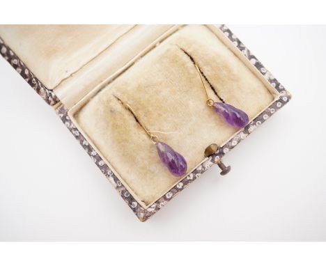 A vintage pair of carved amethyst ear pendants, on yellow-metal French wires, 1.1g