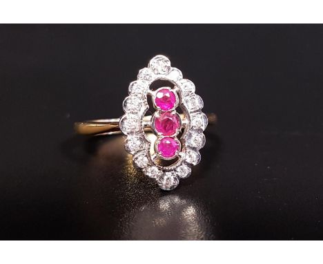 RUBY AND DIAMOND PLAQUE RINGthe central three rubies in vertical setting totaling approximately 0.25cts, in sixteen diamond s