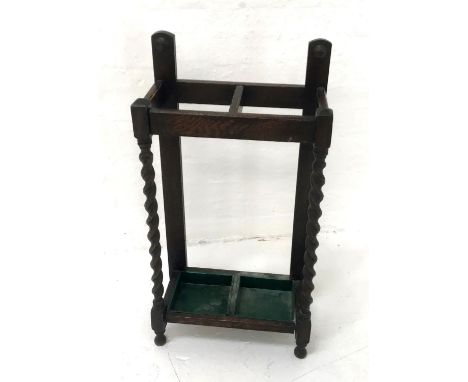 OAK ARTS AND CRAFTS STICK STANDwith two divisions and barley twist front columns, with two metal drip pans, 91cm high 
