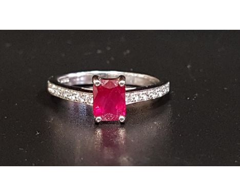 RUBY AND DIAMOND RINGthe central emerald cut ruby approximately 1ct flanked by diamond set shoulders totaling approximately 0