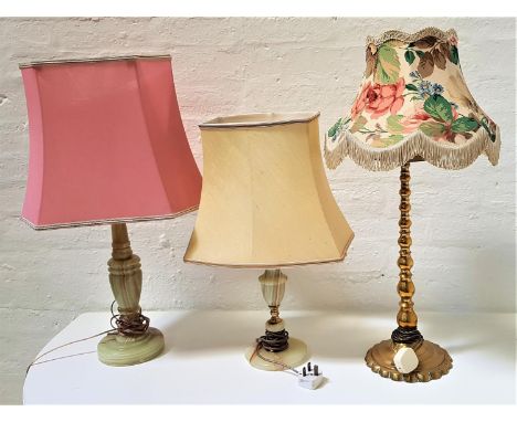 TWO ALABASTER TABLE LAMPSboth with shades; together with a brass tapering table lamp (3) 