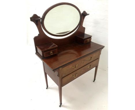 ART NOUVEAU MAHOGANY AND INLAID DRESSING CHESTwith a bevelled oval mirror back above two jewellery drawers, with two long dra
