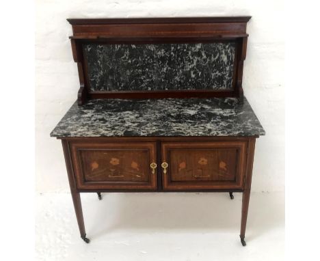 ART NOUVEAU MAHOGANY AND INLAID WASH STANDwith a raised marble back and top above a pair of inlaid cupboard doors below, stan