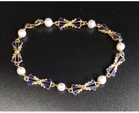 ATTRACTIVE ENAMEL, PEARL AND EIGHTEEN CARAT GOLD BRACELETthe blue enamel decorated bow links separated by pearls, 19cm long, 