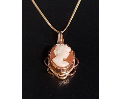 SHELL CAMEO PENDANTthe cameo depicting a female bust in profile, in pierced nine carat gold mount and on nine carat gold chai