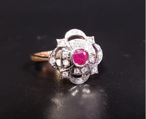 ATTRACTIVE RUBY AND DIAMOND CLUSTER DRESS RINGthe central ruby approximately 0.25cts in multi diamond set pierced surround, o