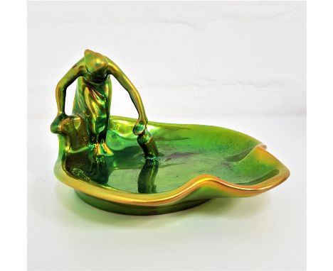 ZSOLNAY EOSIN GLAZED CARD TRAYThe Water Carrier, of irregular shape, gilt mark to base, 15cm wide and 9cm high 