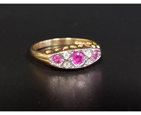 RUBY AND DIAMOND RINGthe three graduated rubies separated by small diamonds, on eighteen carat gold shank, ring size O 