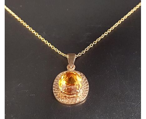 CITRINE SINGLE STONE PENDANTthe oval cut citrine in nine carat gold mount and on nine carat gold chain, total weight approxim