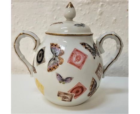 JAPANESE PORCELAIN LIDDED SUGAR BOWLwith simulated bamboo handles, the lid and body decorated with hand painted stamps and bu