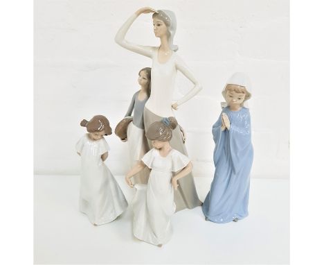 FOUR NAO FIGURINESone a mother and daughter, 36.5cm high, a young girl with her hands together as she prays, 27cm high, a gir