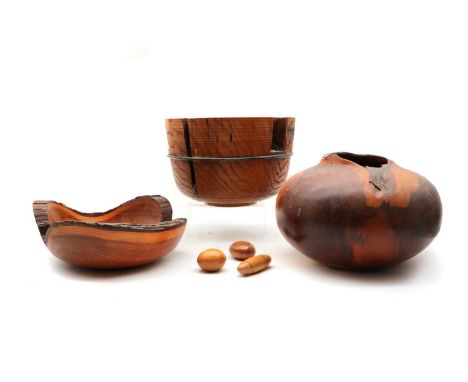 An oak bowl,  of recent manufacture, by Dr Tim Lawson, turned from a partially burnt oak trunk, supported by iron bar, 28cm d