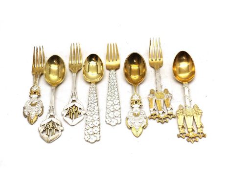 Four pairs of Danish silver Christmas spoon and fork sets by A. Michelsen,all marked Sterling Denmark, with gilt decoration, 