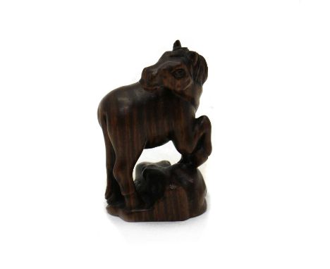 A Japanese hardwood netsuke, 20th century, modelled as a horse, signature to base5.5cm highGood condition no visible cracks o