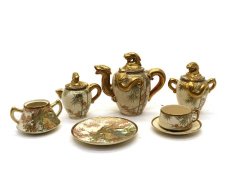 A collection of Japanese Satsuma ware tea services,early 20th century, comprising: a teapot, two sugar bowls, a milk jug and 