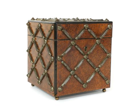A small partridge wood tea caddy, 20th century, French, with gunmetal studs,14cm wide14.5cm high14cm deepProvenance: Bracken 