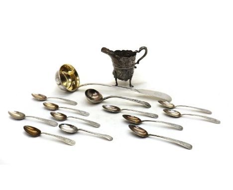 A collection of silver items,to include a 19th-century German fiddle pattern ladle, marked 800, 35cm long, a footed cream jug