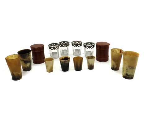 A group of mantelpiece items, including eight horn beakers, two leather candle holders, four glass candle holders with metal 