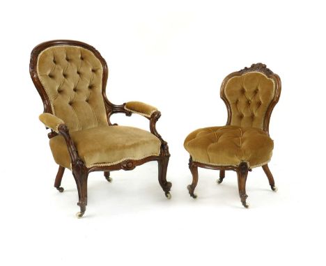 A mid-Victorian button upholstered open armchair,button upholstered in a gold fabric, to a leaf and scroll carved frame72cm w