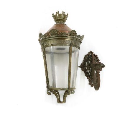 A copper and brass lantern,of tapering cylindrical shape with cast brass decoration, with a pierced scrolled bracket mount,la