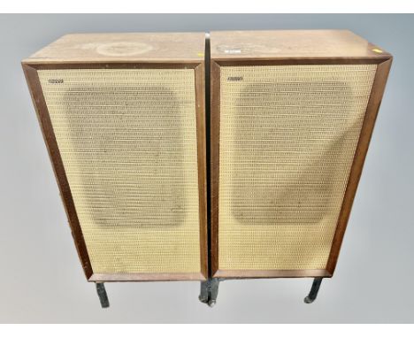 A vintage pair of B & W model DM3 teak cased speakers on metal stands 