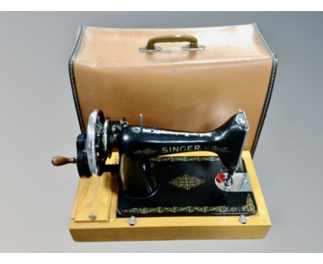 A vintage Singer sewing machine in case 
