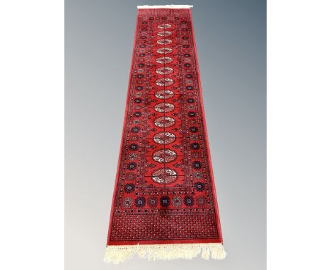 A Bokhara runner, Afghanistan, 270cm by 69cm