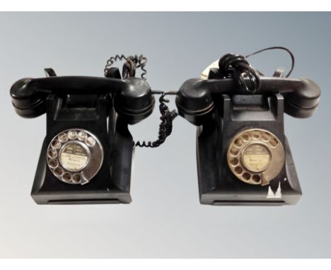 Two vintage black Bakelite rotary telephones 