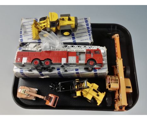 A Conrad scale model of a city of Miami fire engine, boxed, Conrad scale model of a Hanonag 70 E bulldozer, boxed, and three 